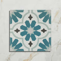 Vacation porcelain cordoba tile with teal and white geometric pattern and black accents for stylish flooring