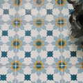Blue and white geometric patterned porcelain floor tiles with yellow accents vacation porcelain tangier design