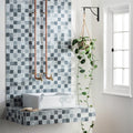 Venetia Glass Mosaic grey and black glass mosaic with a white vessel sink on a floating countertop