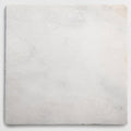 Venetian white 40 x 40cm square off-white marble tile with subtle gray veining and a slightly textured surface