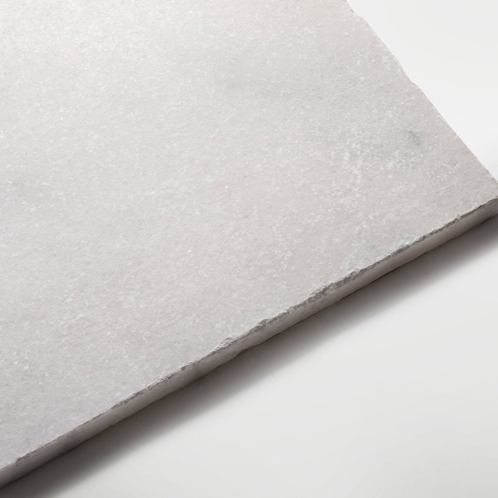 Venetian white 40 x 40cm light gray stone tile with a subtly textured natural surface and irregularly cut edges