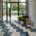 Black and white marble tiles in a geometric pattern featuring versailles marble vert honed finish on the floor