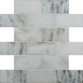 Viano white honed brickbond mosaic of white marble subway tiles with subtle gray veining arranged in brick pattern