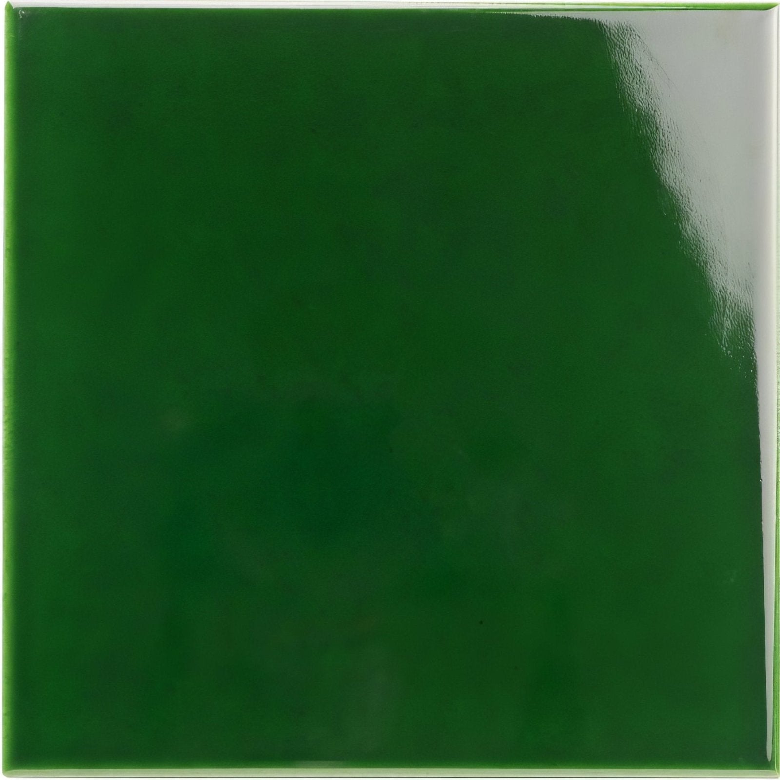 Victorian green field tile featuring a glossy deep green square ceramic surface with smooth reflective finish