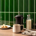 Black french press coffee maker with silver-plated lid knob featured in victorian green large brick design