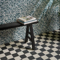 Victorian Style Porcelain Chess Mono A black and white checkerboard tiles with a black a-frame stool