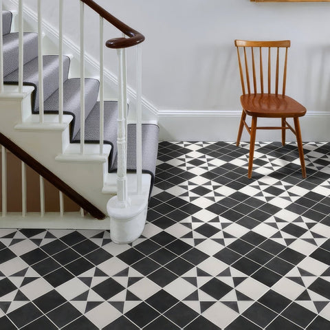 Black and white geometric patterned Victorian style porcelain floor tiles in Finchley pattern cotton white finish