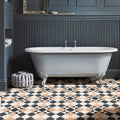 Victorian Style Porcelain Finchley Pattern Sandstone beige geometric tiles with a white clawfoot bathtub