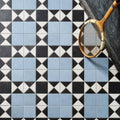 Victorian Style Porcelain Finchley Pattern Sky Blue blue geometric tiles with a vintage wooden tennis racket