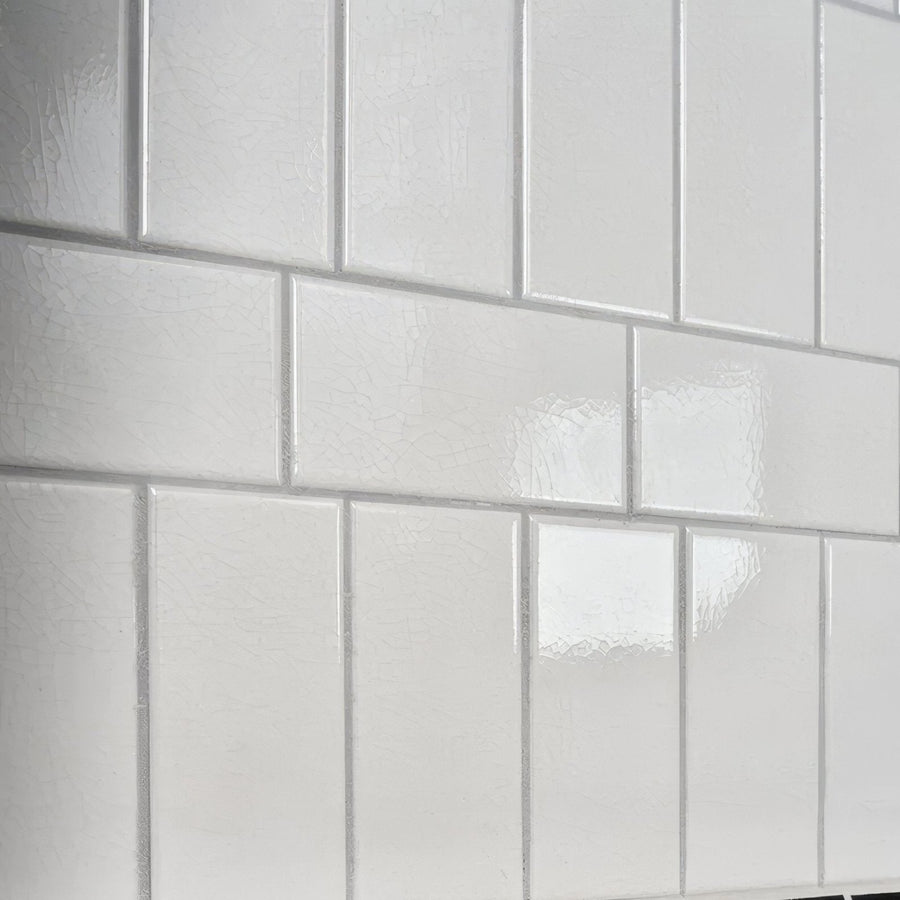 White glossy Victorian Style wall ceramic tiles with antique white crackle glaze arranged in classic brick pattern