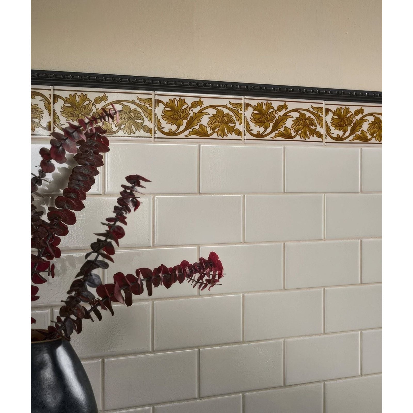 Victorian style wall ceramic cotton white metro with white subway tiles and a decorative gold floral border tile above