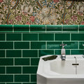 White ceramic Victorian Style™ sink with chrome faucet and emerald green metro tiled backsplash wall installation