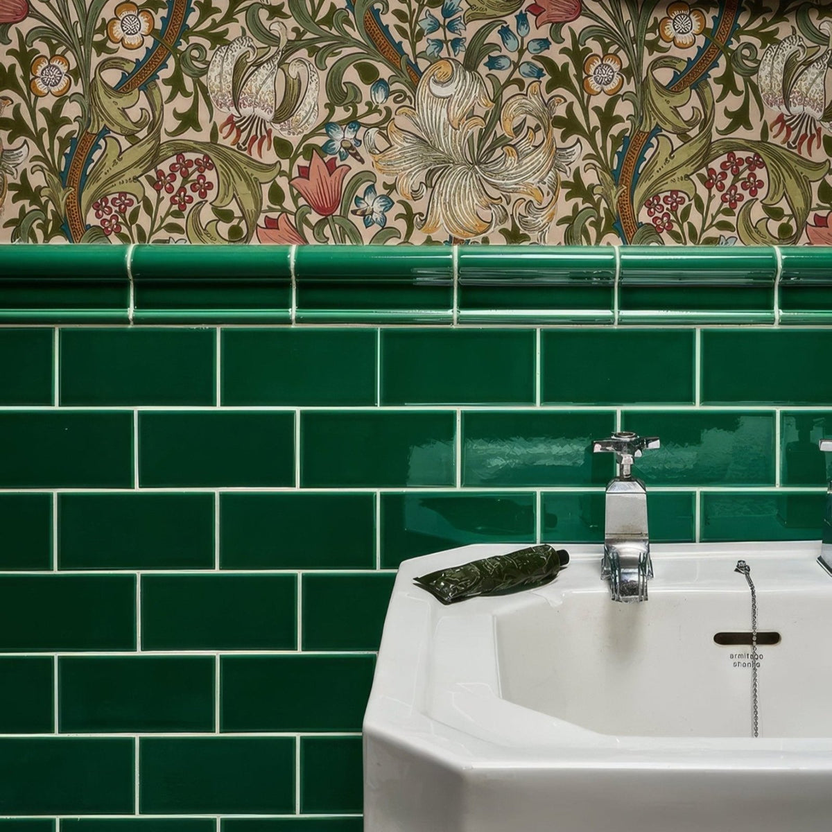
White ceramic Victorian Style™ sink with chrome faucet and emerald green metro tiled backsplash wall installation