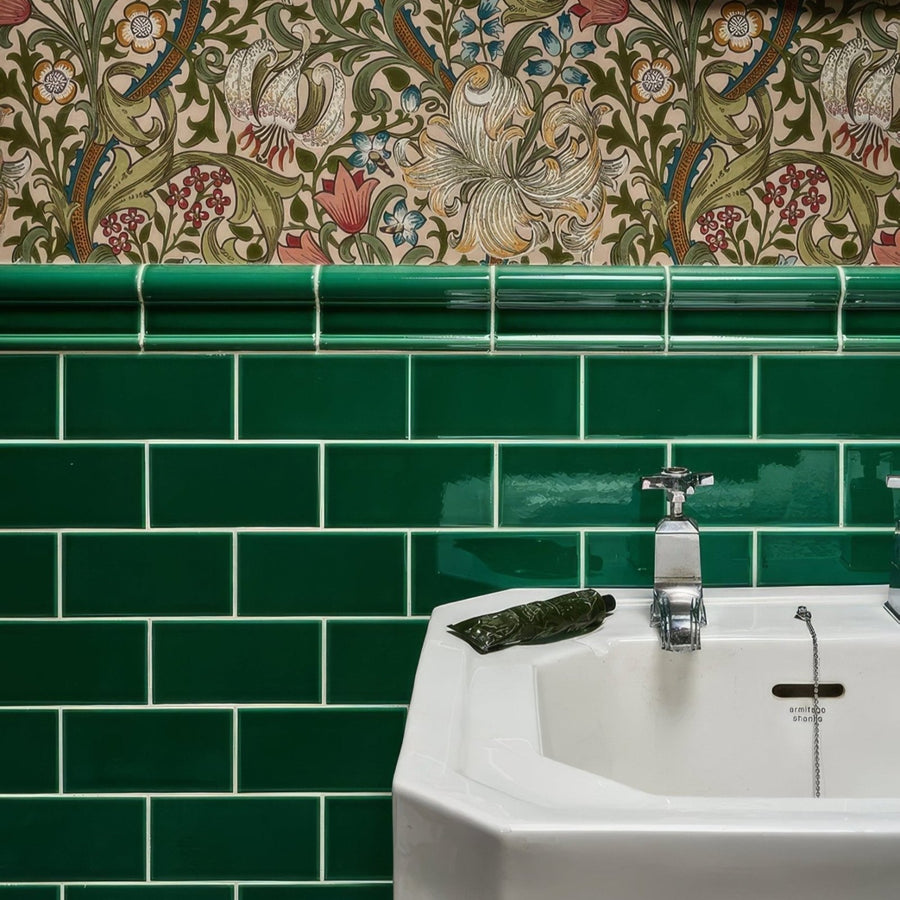 White ceramic Victorian Style™ sink with chrome faucet and emerald green metro tiled backsplash wall installation