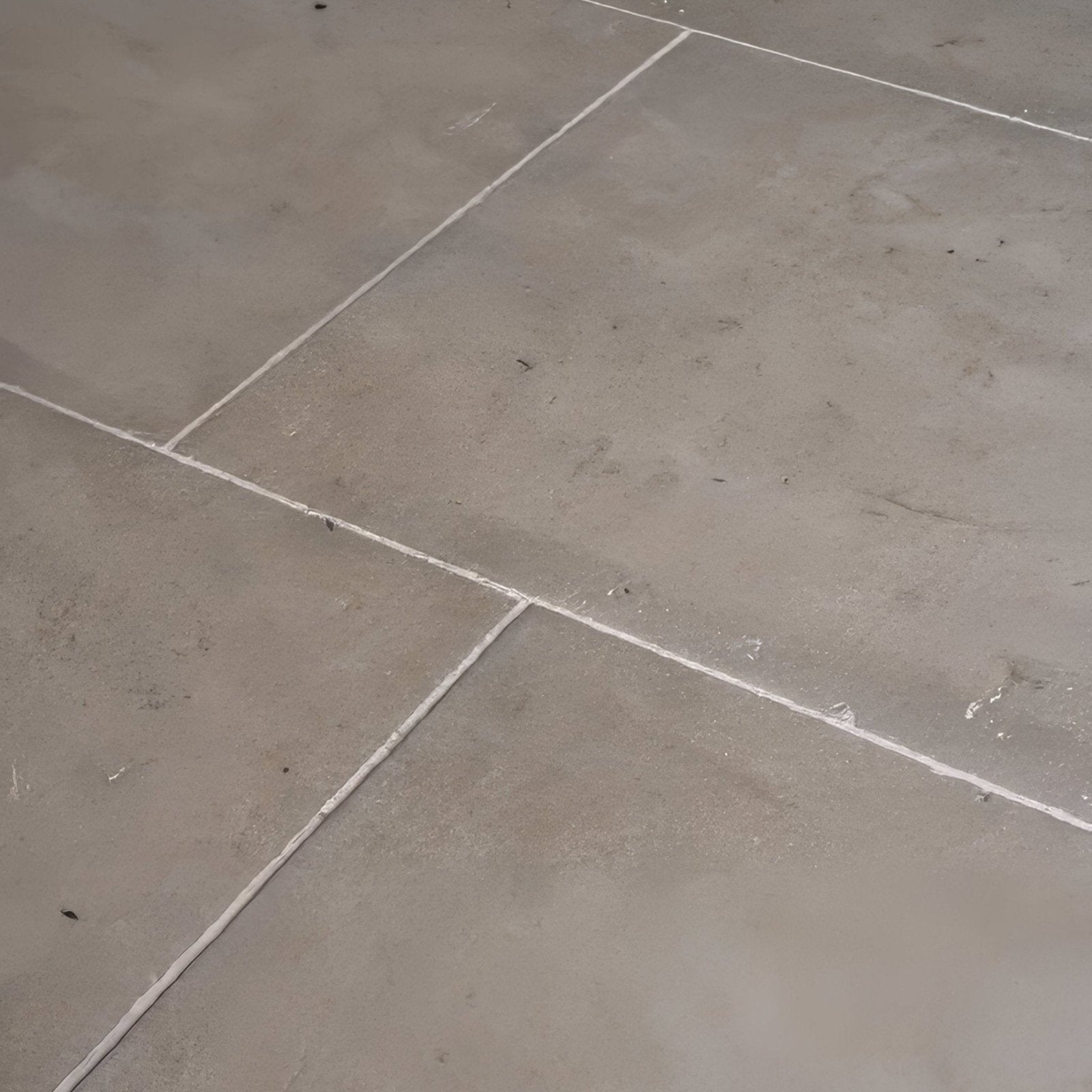 Gray vienne limestone satino stone tiles with subtle veining and white grout lines for flooring and wall use