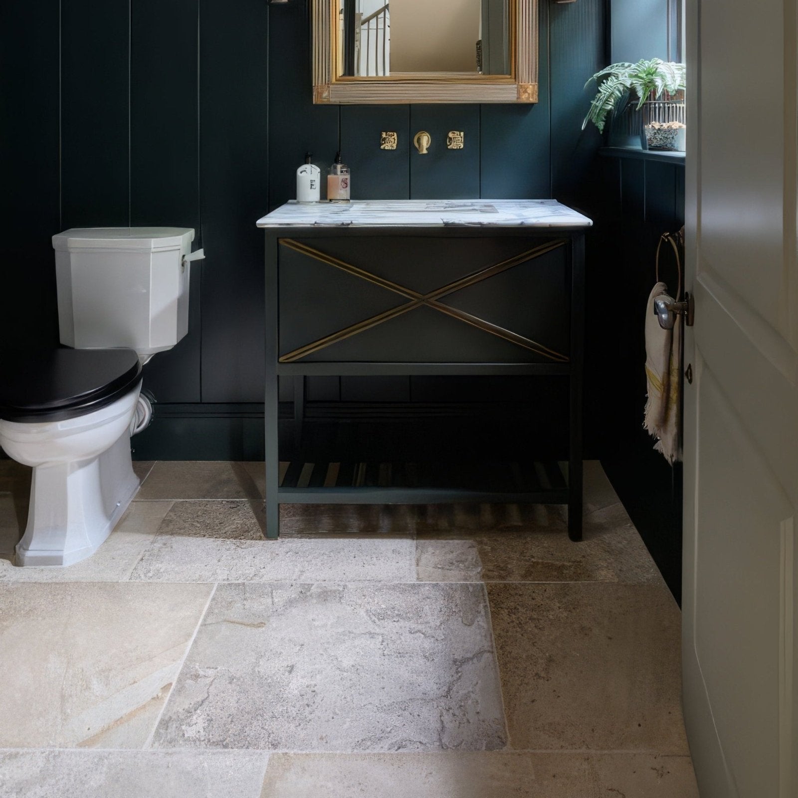 Dark green vanity with gold cross detailing and white marble countertop featuring vieux bourgogne limestone finish