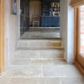 Stone steps with integrated underlighting in vieux bourgogne limestone ancient finish natural gray rustic texture