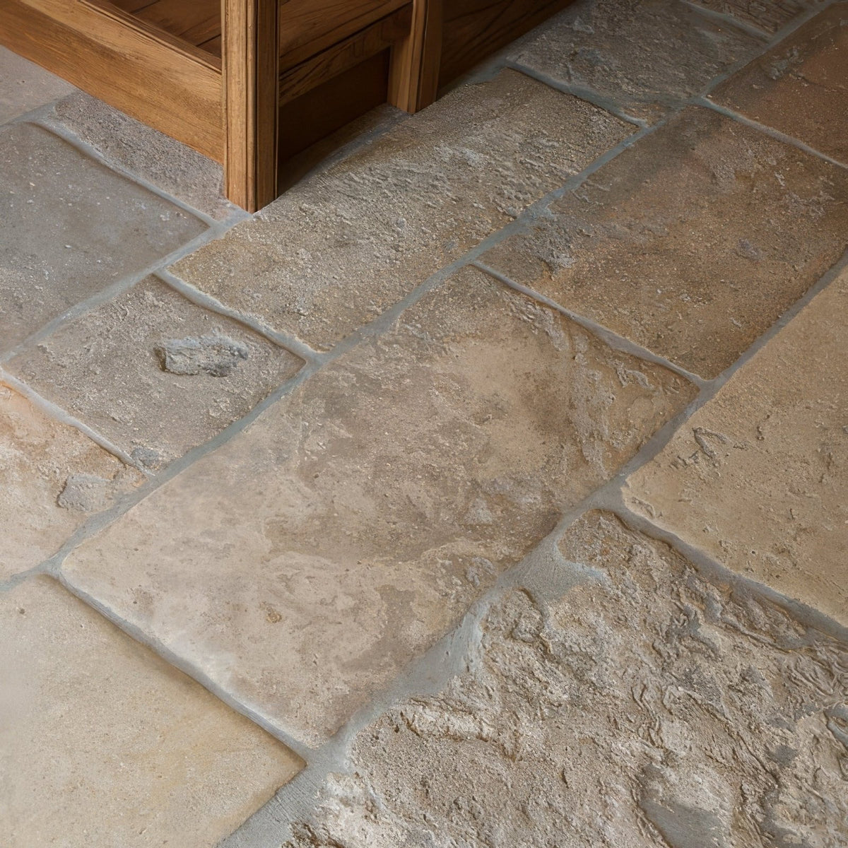 Beige and tan vieux bourgogne limestone tiles with rustic textured artisan antiqued finish for elegant flooring