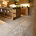 Natural stone floor tiles in vieux bourgogne limestone with a rustic earthy tone and textured artisan antiqued finish
