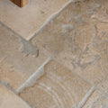 Vieux bourgogne limestone beige stone tiles with artisan antiqued finish featuring natural irregular edges and tone variations