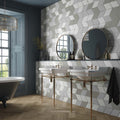 Two white ceramic vintage rhomboid pedestal sinks with brass metal legs and fixtures for bathroom use