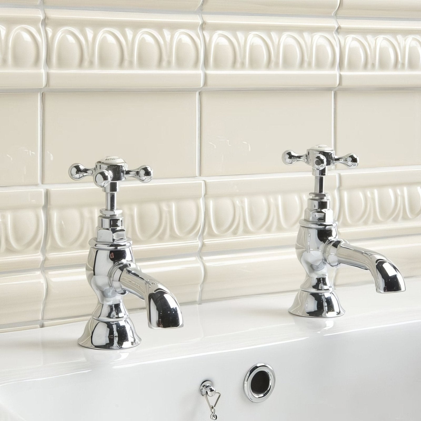 Vintage white egg and dart moulding chrome finished bathroom faucet set with cross handles and curved spouts