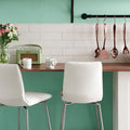 Vintage white omega moulding featuring a mint green retro-style radio with beige grille and curved handle