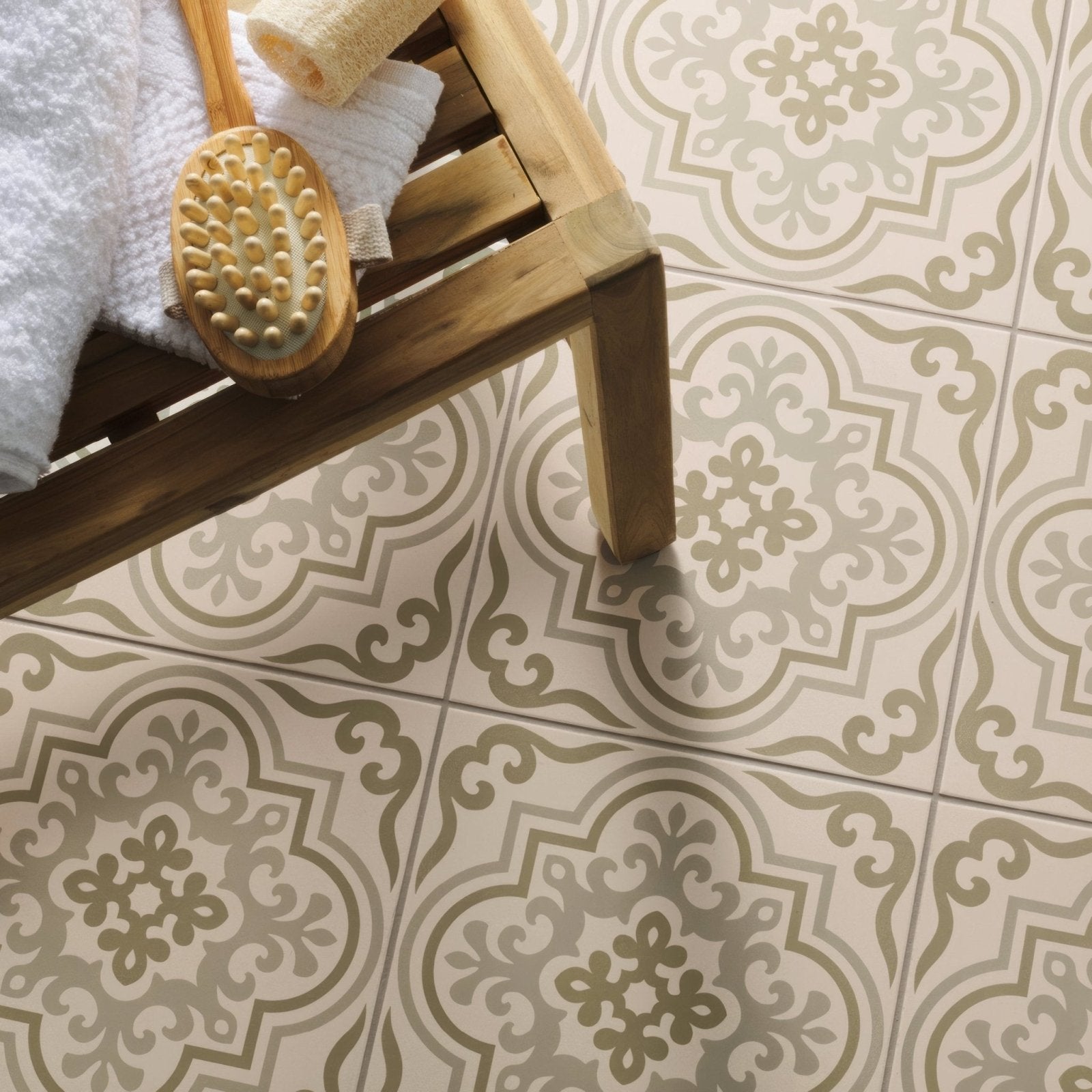 Beige and taupe patterned ceramic floor tiles with ornate symmetrical floral designs in vogue green on chalk color scheme