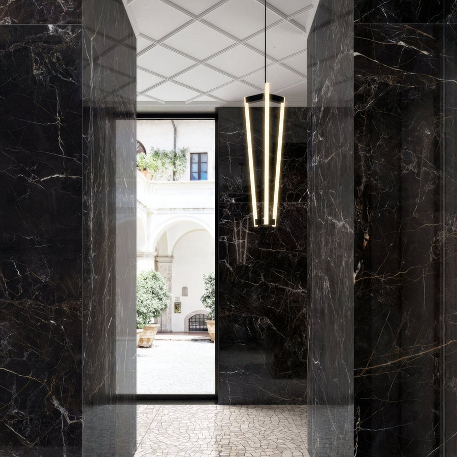 Volterra Laurent Gloss 60 x 120cm black marble-effect tiles with a pendant light