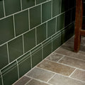 Dark green victorian style wall ceramic cabbage green rectangular tiles with glossy finish and white grout lines in subway pattern