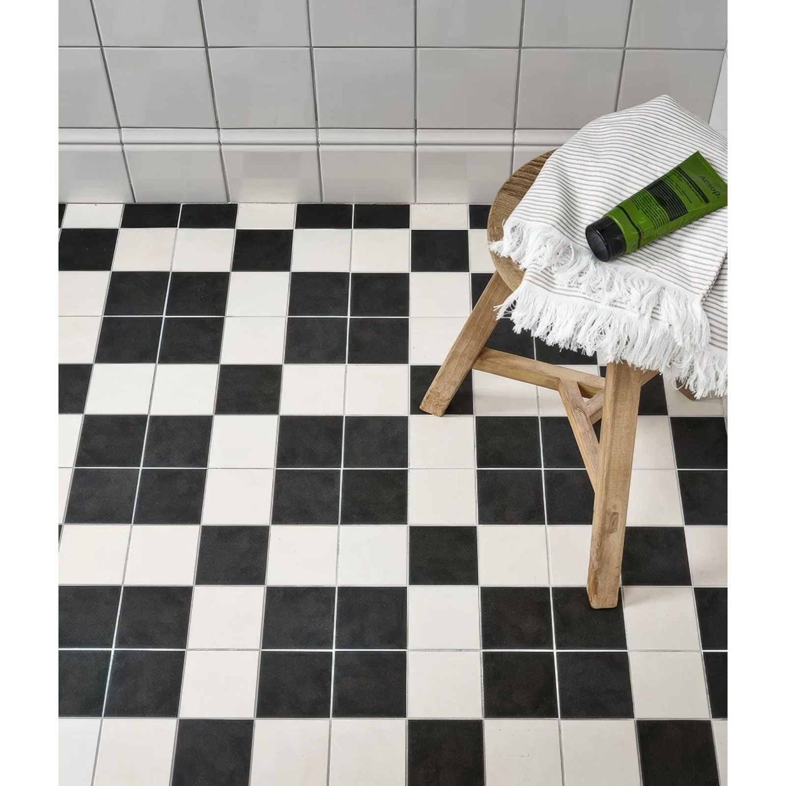 Black and white checkered matte floor tiles complementing victorian style wall ceramic cotton white skirting