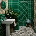 Victorian Style wall ceramic emerald green square crackle glaze subway tile bathroom walls with white grout and gray herringbone floor