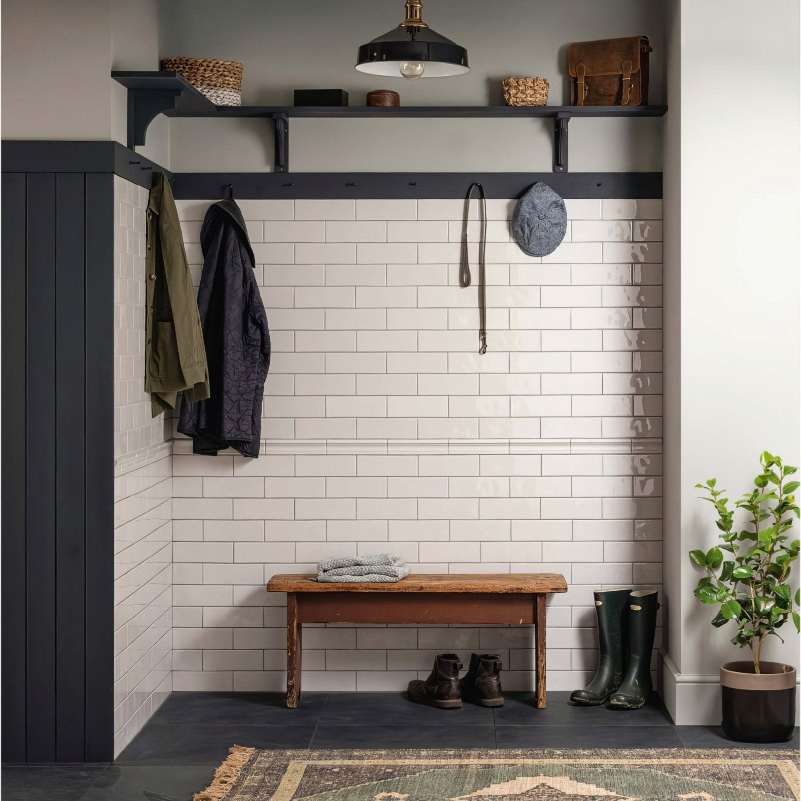 White brick tile waveney wall with black metal shelf and hooks showcasing subway tile design and storage features