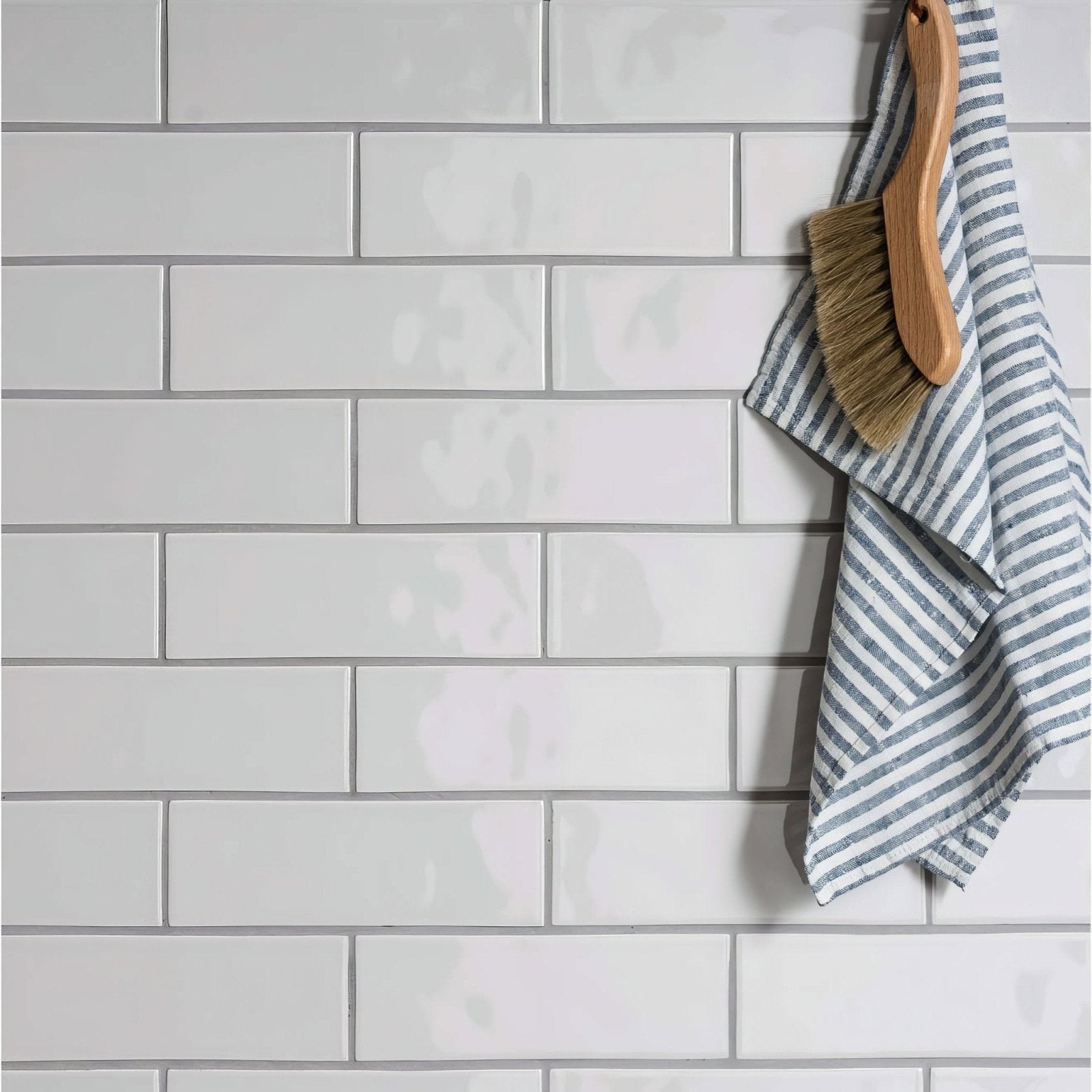White rectangular subway brick tile waveney wall with gray grout for modern interior design