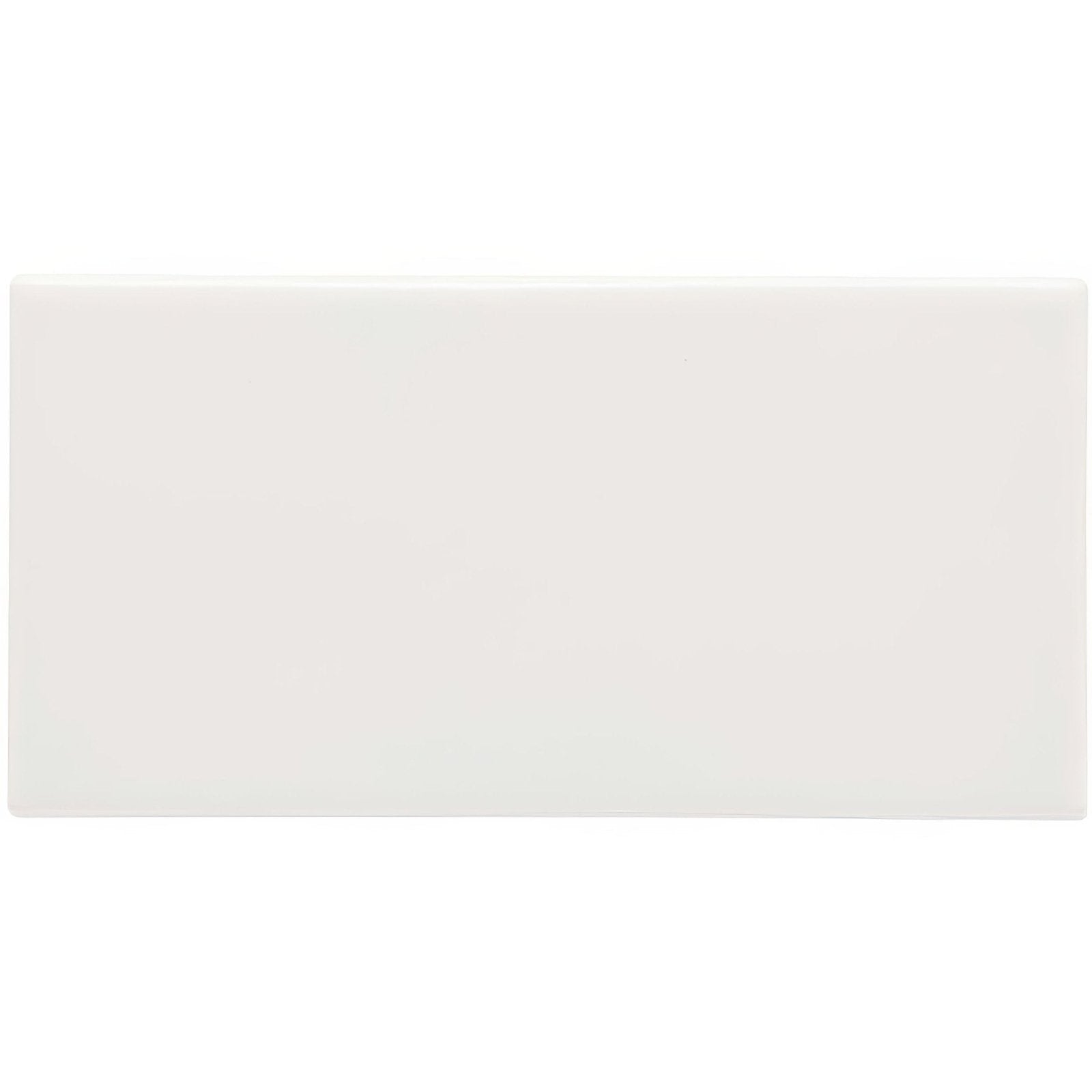 A sleek minimalist white rectangular waveney half tile with a smooth glossy finish for wall installations