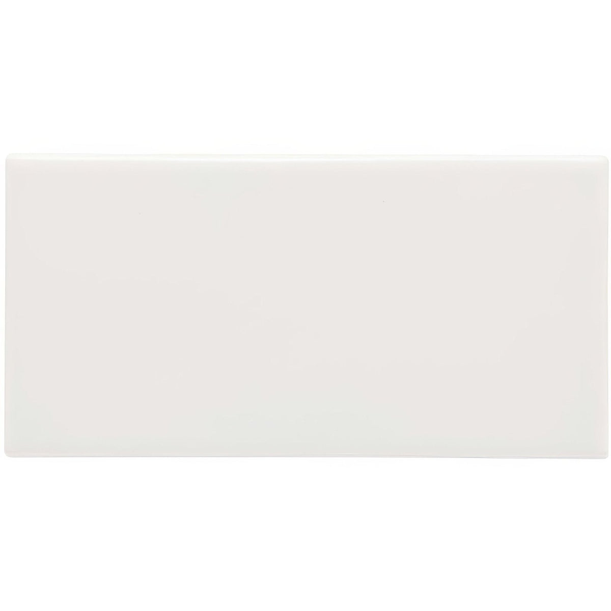 A sleek minimalist white rectangular waveney half tile with a smooth glossy finish for wall installations