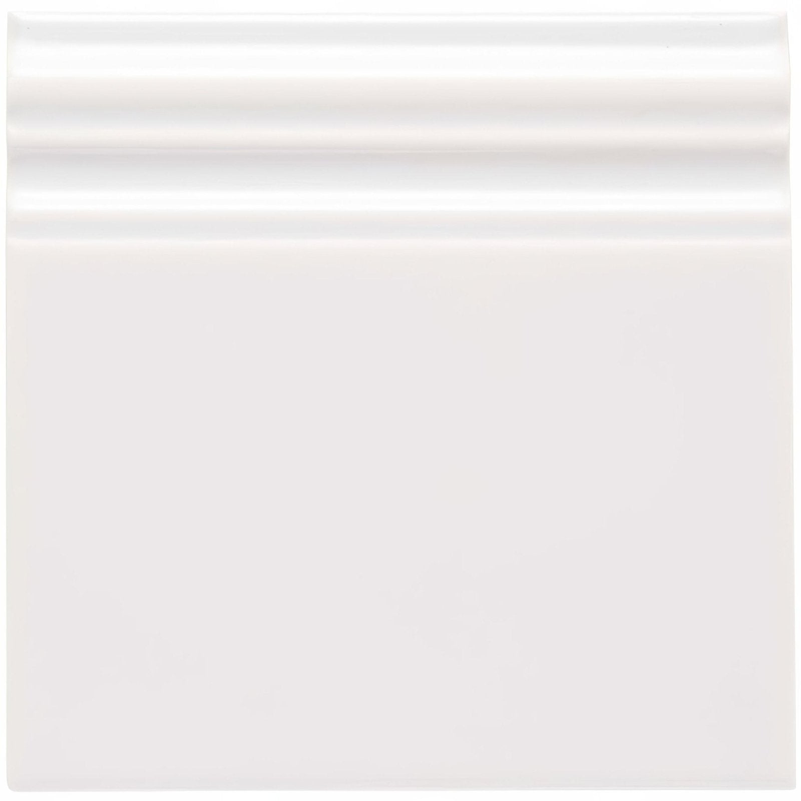 Waveney skirting white ceramic tile with smooth glossy finish and subtle horizontal ridges along the top edge