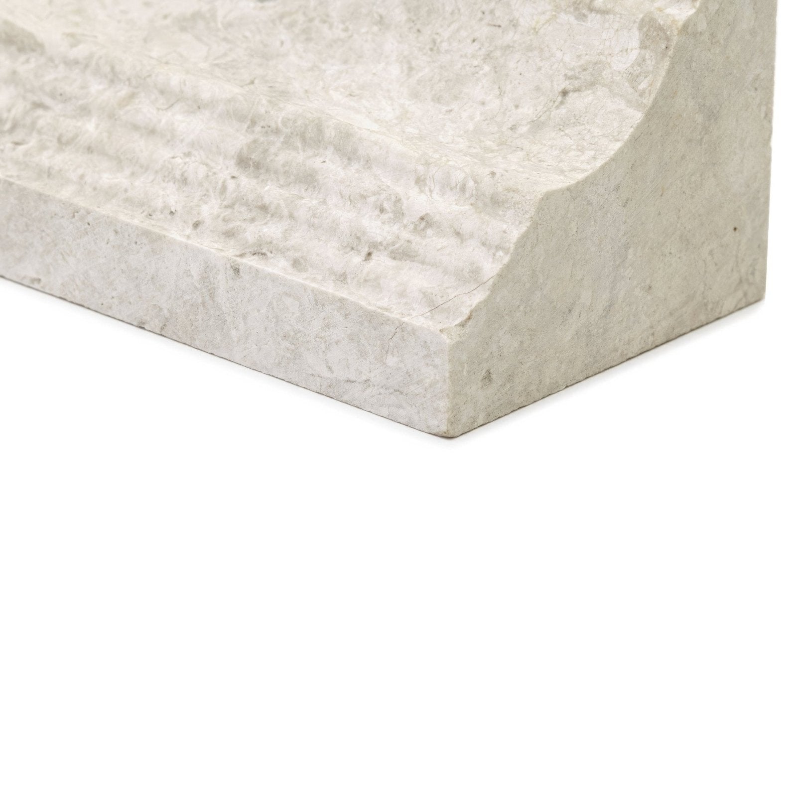 Light gray textured stone corner molding with subtle natural veining from westhampton dado honed collection
