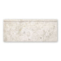 Westhampton skirting honed cream-colored marble tile with subtle gray and beige veining for wall base applications