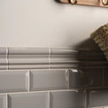Westminster grey metro bevelled tile showing gray glossy subway tiles with subtle ribbed texture and white grout lines