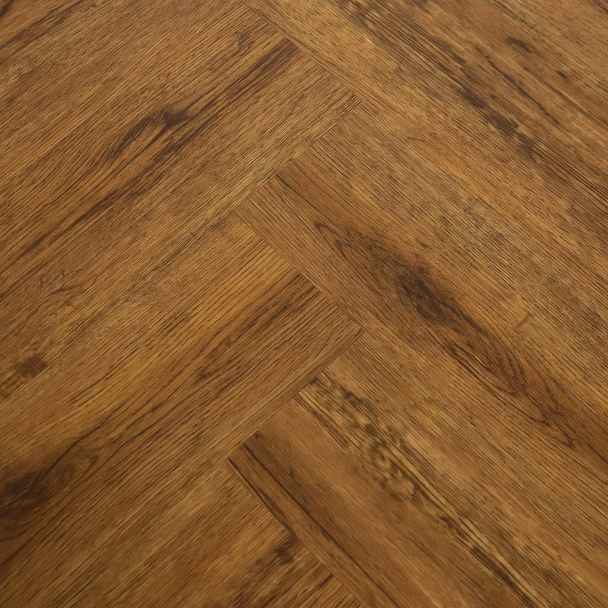 Warm brown hardwood flooring in a herringbone pattern featuring vine oak in the weymouth collection