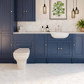 White Marble Hexagon Porcelain white marble-effect hexagon porcelain tiles with a navy shaker vanity