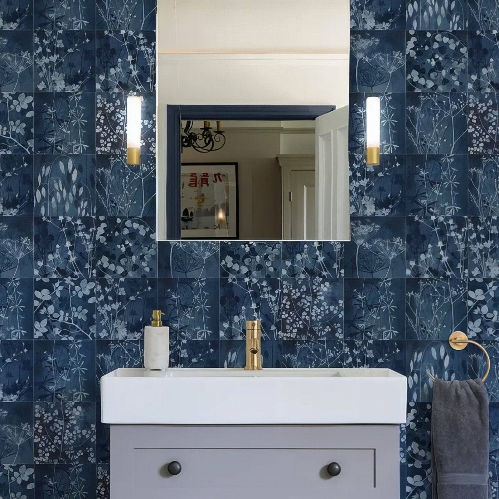 Wild Botanicals Porcelain Blue By Clarissa Hulse dark blue botanical porcelain tiles with a white sink and gold tap