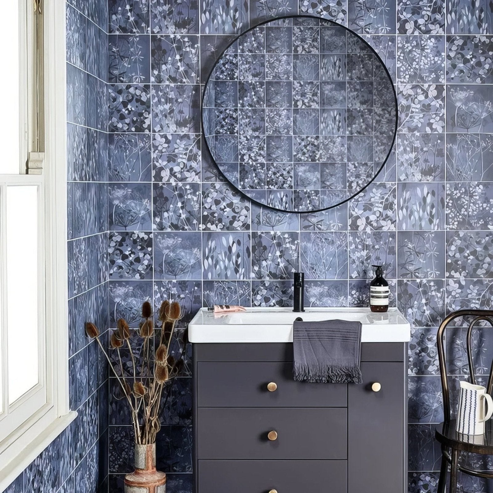 Wild Botanicals Porcelain Blue By Clarissa Hulse dark blue botanical porcelain tiles with a round black-framed mirror
