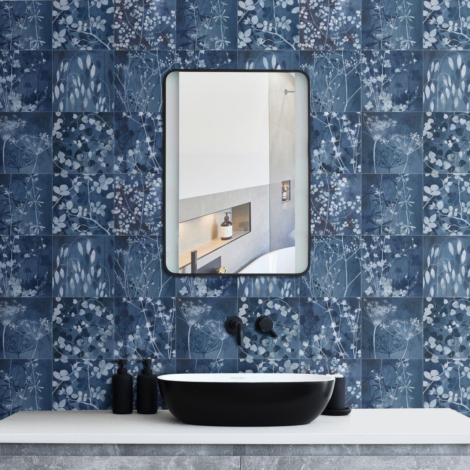 Wild Botanicals Porcelain Blue By Clarissa Hulse dark blue botanical porcelain tiles with a black oval vessel sink