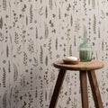 Wildflower violet 60x30cm featuring a translucent green glass bottle with narrow neck and rounded shoulders on wooden stool