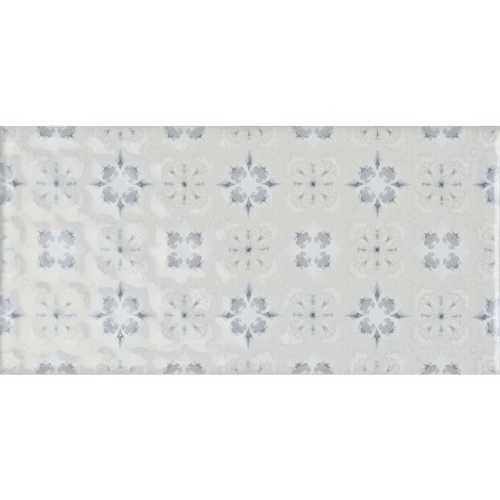 A glossy white rectangular tile with gray quatrefoil and starburst motifs from wisley on helmingham collection