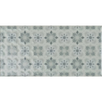 A rectangular ceramic tile wisley on sudbury with a subtle gray and white ornamental pattern on a light background