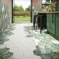 Hexagonal woodland glade porcelain floor tiles with white and green botanical leaf patterns for modern interiors