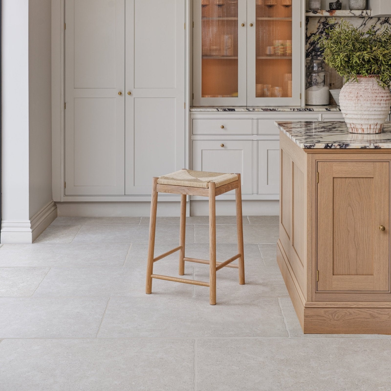 Wychwood Claire Porcelain Matt 60 x 90cm beige stone-effect porcelain tiles with a wicker stool